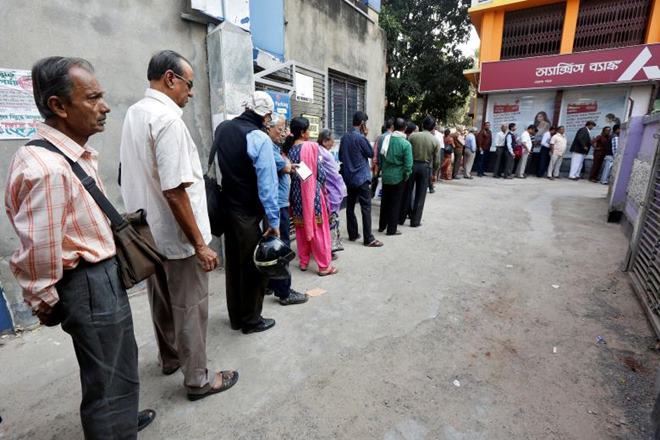 Are the queues there because money supply has fallen in the economy? It’s not that simple. Yes, cash in circulation has taken a hit, with the black and fake notes being weeded out. (Reuters)