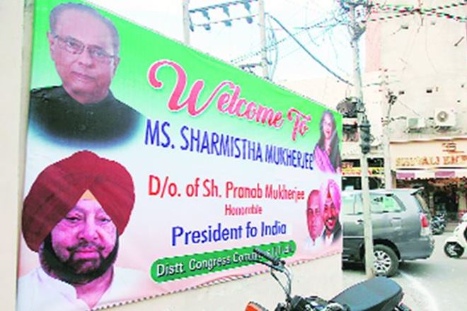 The Ludhiana unit of Congress in an election campaign meeting on Friday, put up hoardings in which they used photograph and name of Dr Pranab Mukherjee, the President of India. (IE)