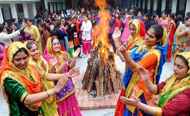 College girls wearing traditional colorful dress and performing Punjabi Gidda on the occasion of Lohri festival celebrating at Amritsar on Tuesday, January 13 2015. EXPRESS PHOTO BY RANA SIMRANJIT SINGH