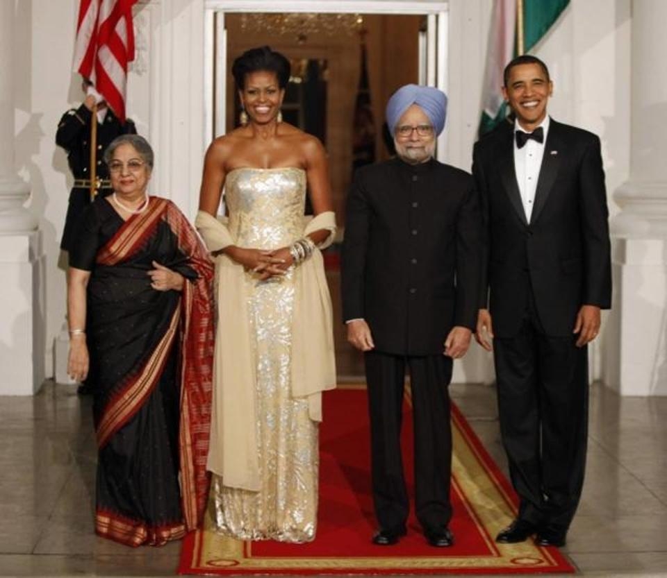 At the state dinner on the North Portico of the White House, with then Prime Minister Manmohan Singh and his wif Gursharan Kaur, Michelle Obama was dressed in a silver patterned dress designed by Indian-born designer, Naeem Khan. (Reuters)