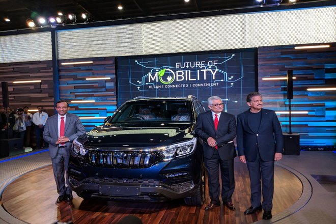 Dr. Pawan Goenka, Rajan Wadhera and Anand Mahindra along with the new Mahindra SUV at Auto Expo 2018, upcoming Mahindra cars