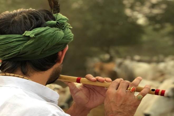 Tej Pratap Yadav, former bihar minister tej pratak yadav, tej pratap yadav as lord krishna, tej pratap yadav playing flute
